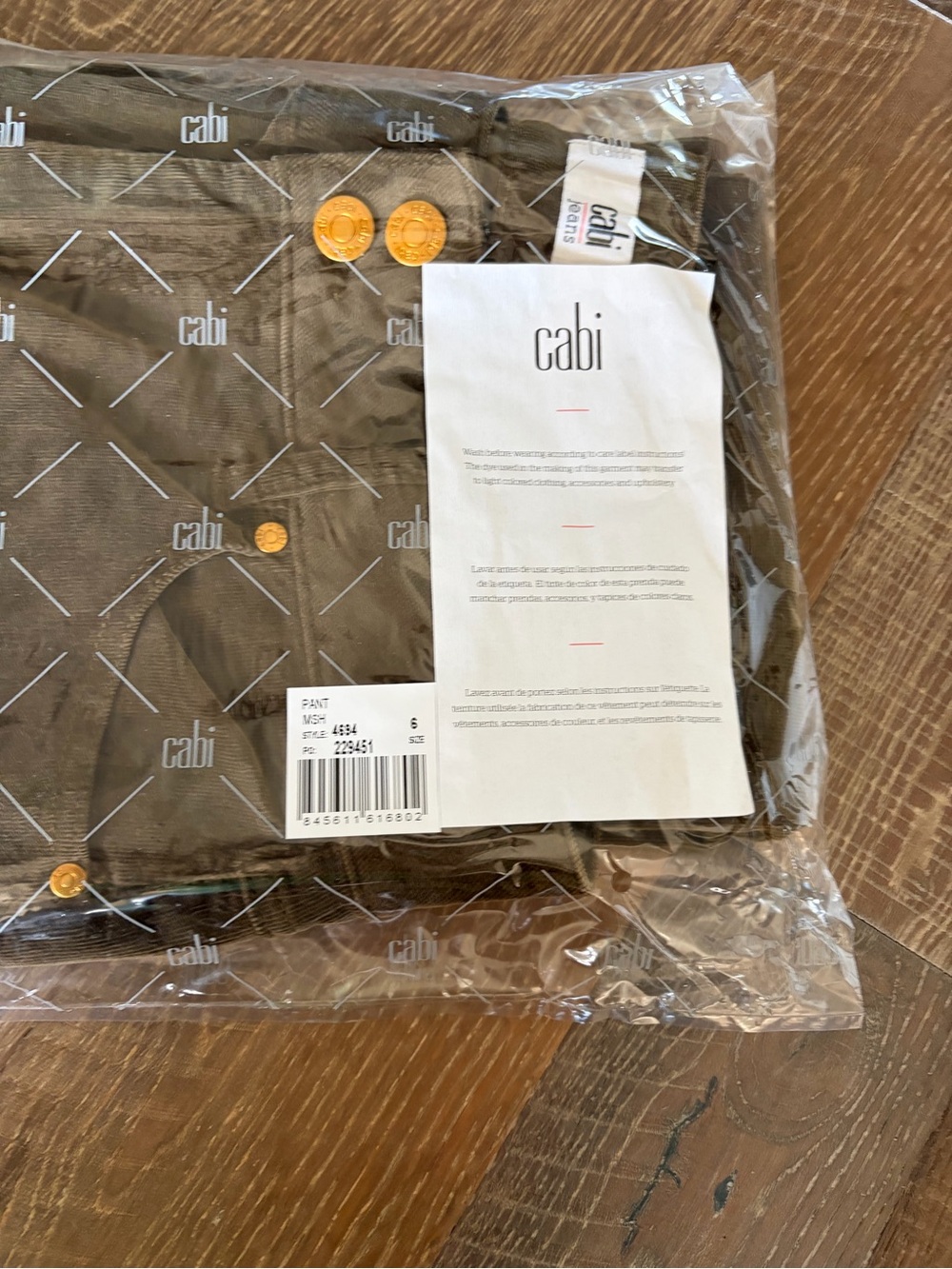 CAbi High-Low Crop Flare Jeans in Olive Green - Picture 4 of 4